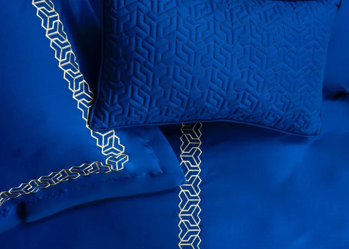 Cobalt blue duvet cover set with geometric trim and textured pillow shams