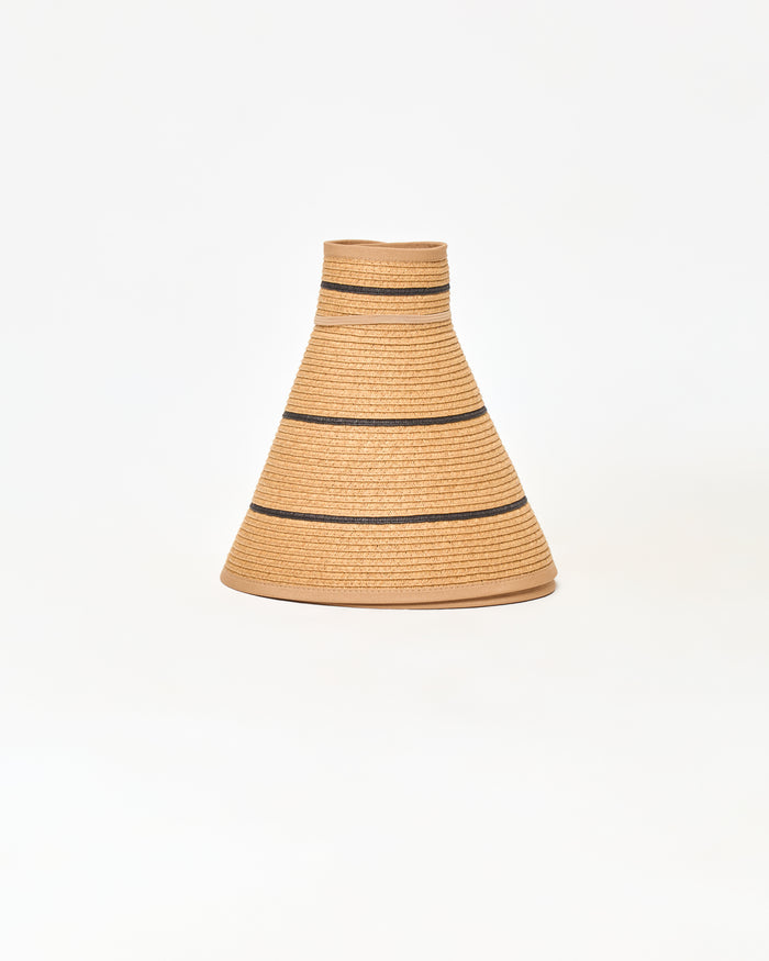 Off-model image of the natural and black Jess Roll Up Hat in its rolled cone shape showing the natural straw with black stripe.