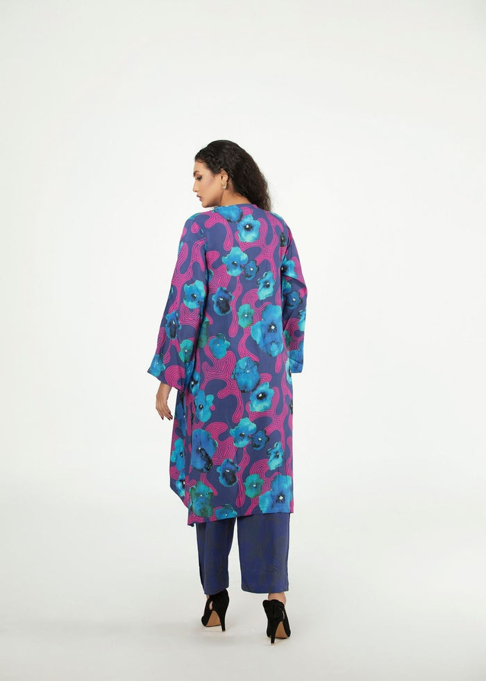 Women’s tunic and pants set with blue and purple floral print, back view