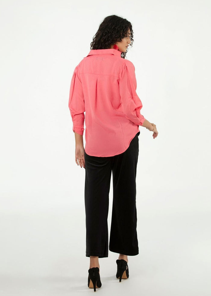 Women's pink button-up shirt, back view with gathered shoulders and long sleeves