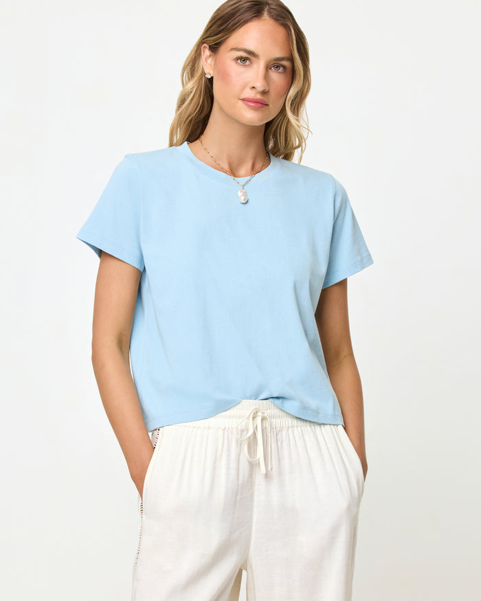 LSPACE All Day top in sky blue, close-up detail view on model.