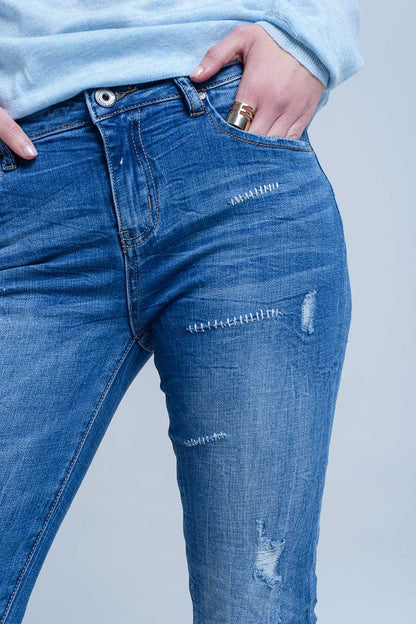 Ankle jeans with rip and repair - Denim