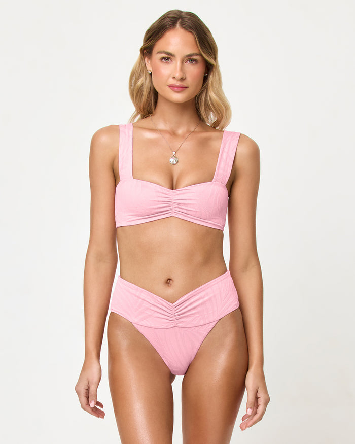 LSPACE Bardot bikini bottom in Pink Sugar, front view on model.