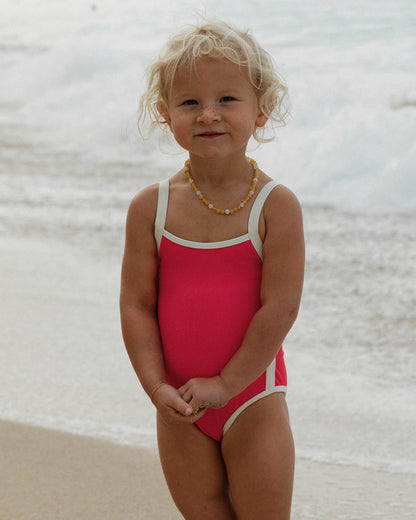LSPACE Beach Skipper one piece in Pout-Cream, lifestyle/editorial view on model at the beach.