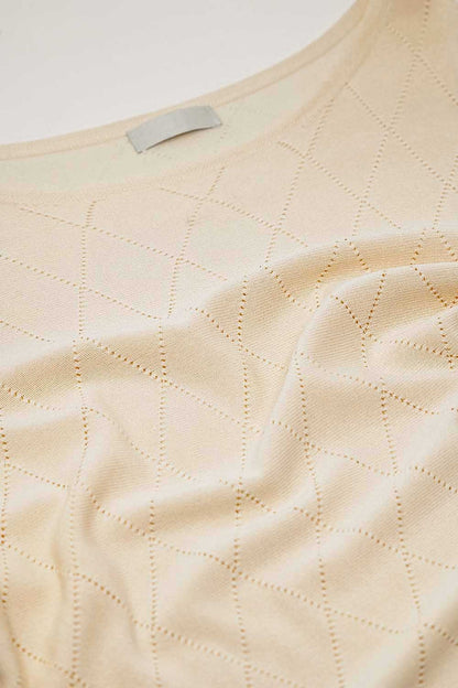 Beige sweater in argyle print with boat neck