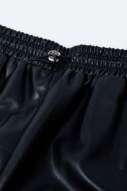 Black faux leather shorts with gathering at the waist with drawstring - trousers