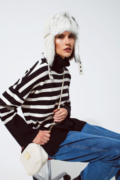 Black oversized trutleneck sweater with white stripes and splits on the side