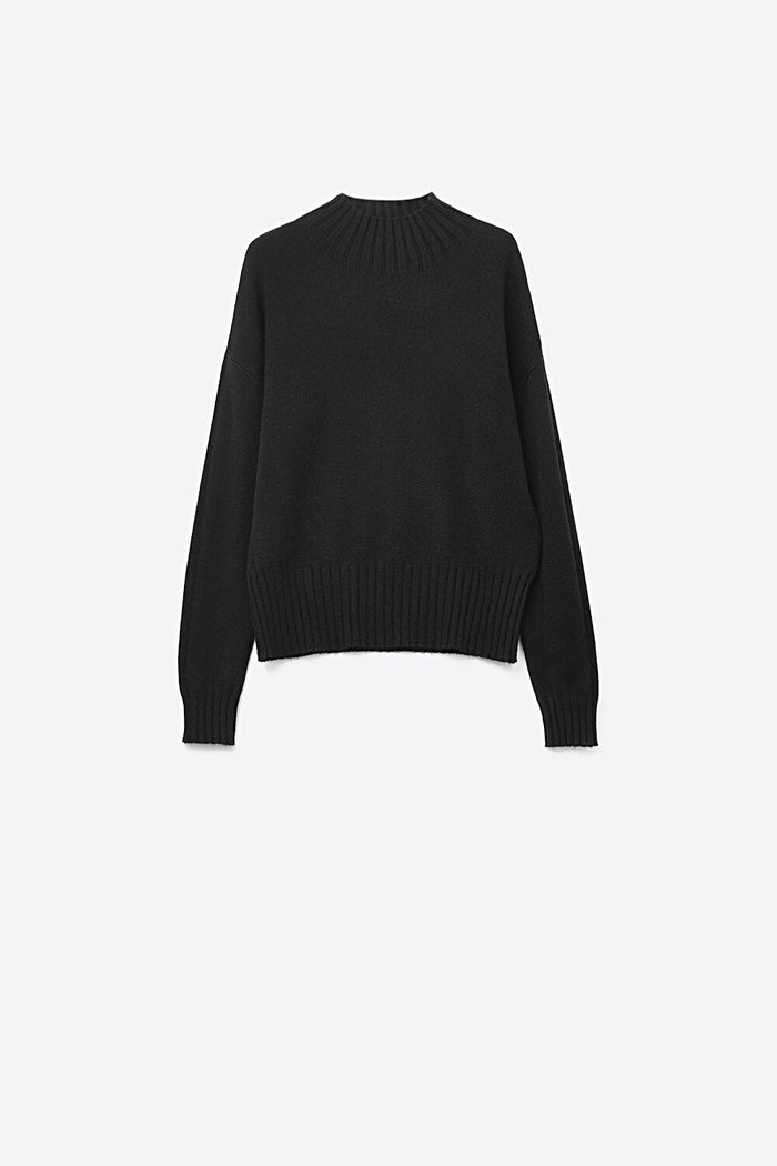 Black soft knit sweater with ribbed cuffs and neck