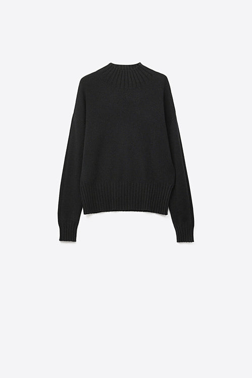 Black soft knit sweater with ribbed cuffs and neck