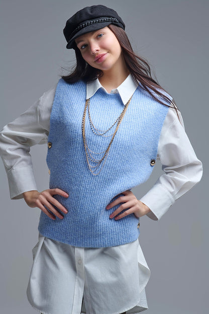 Blue sleeveless sweater with gold buttons on side