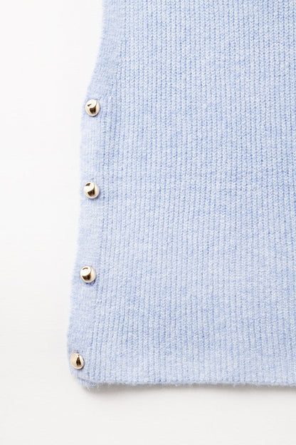 Blue sleeveless sweater with gold buttons on side