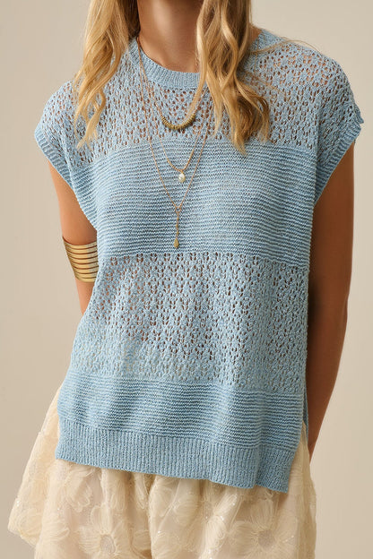 Blue sweater with soft open knit and dropped sleeves