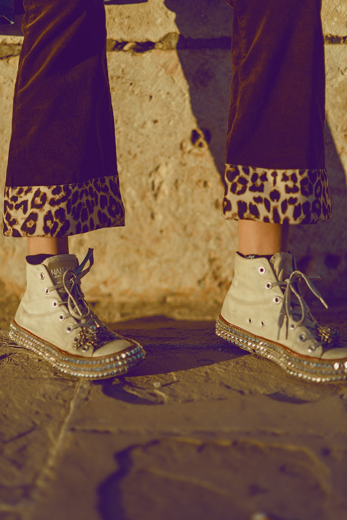 Brown corduroy flare pants with leopard print at the bottom - trousers