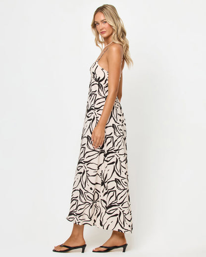 Side view of a model wearing the LSPACE Chara Maxi Dress in heavy petal, showing the full-length silhouette and open back detail, on a white studio background.