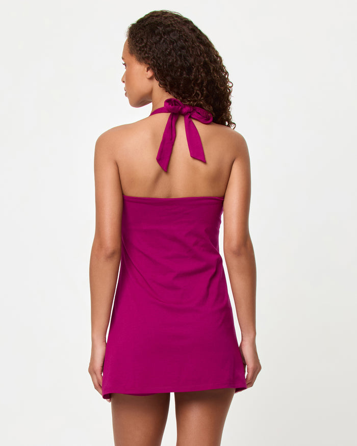LSPACE Cherie dress in berry jam, back view on model.