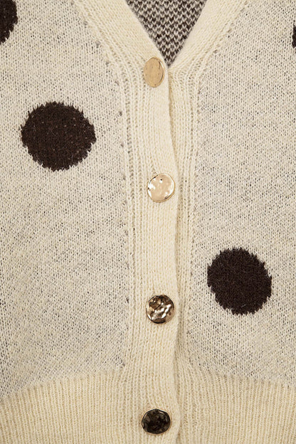 Cream knitted jacket with large brown polka dots and gold buttons