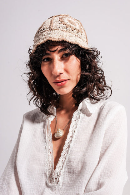 Crochet bucket hat with daisy detail in beige