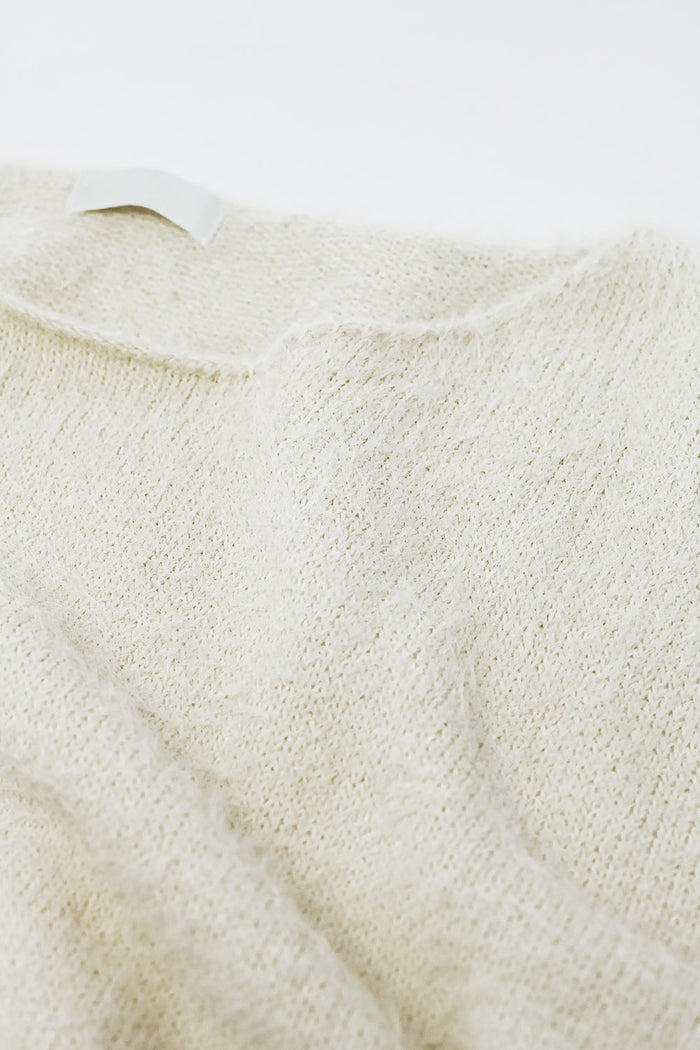 cropped fluffy sweater in cream fitted at the waist