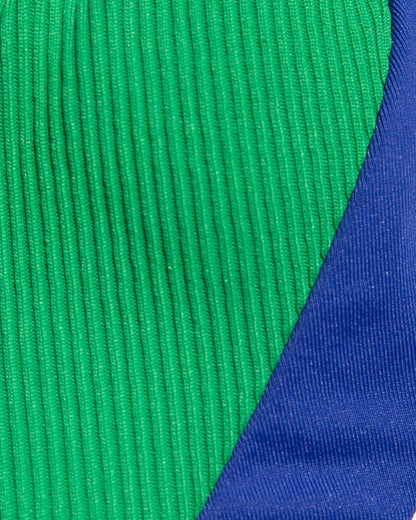 Close-up of green and cobalt blue ribbed fabric.