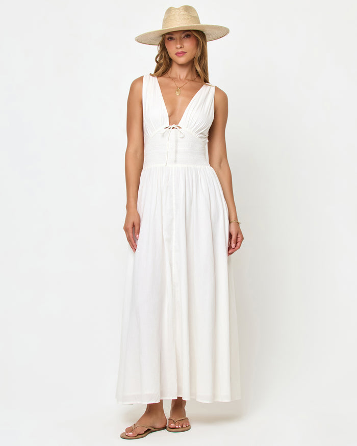 LSPACE Emmaline maxi dress in cream, front view on model wearing a straw hat.