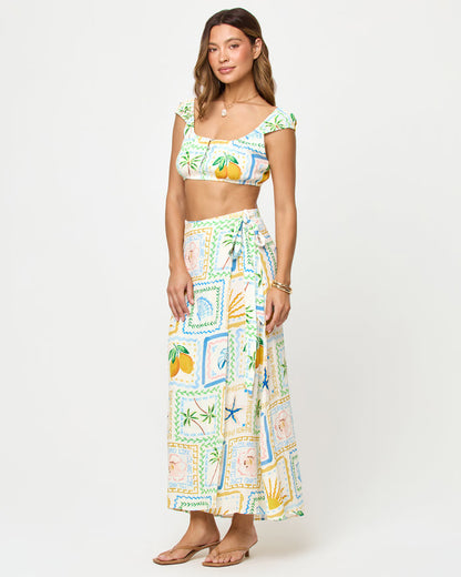 LSPACE Ever Top and Every Wrap Skirt in Wish You Were Here print, three-quarter view on model.