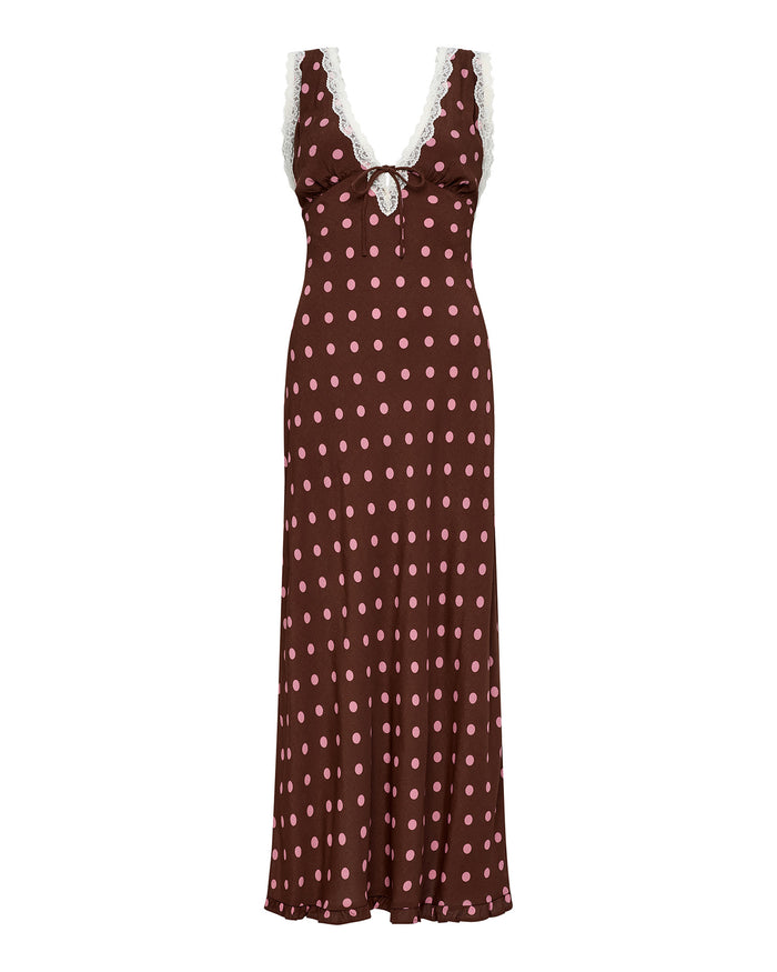 Off-model view of the LSPACE Eyes On You Maxi in Alotta Polka Dot, a full-length brown maxi dress with large pink polka dots, white lace trim V-neckline, and tie-front waist.