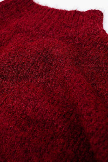 Fluffy red sweater with high neck and balloon sleeves