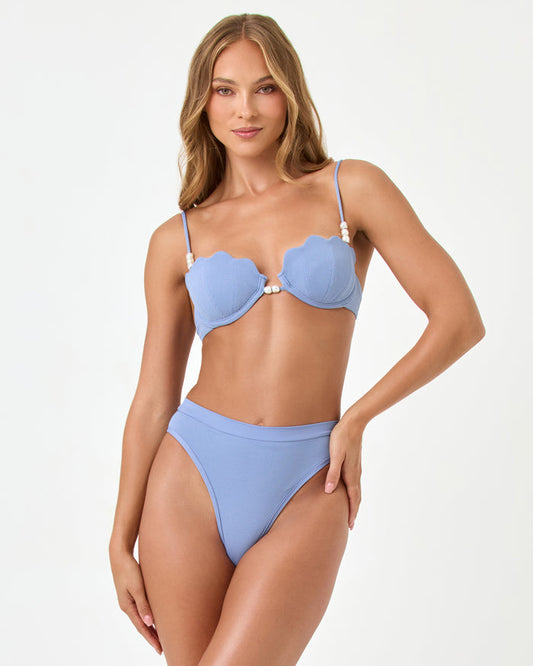 Front view of a model wearing the LSPACE chambray Sunrise Shell Bikini Top styled with the Frenchi Bikini Bottom.