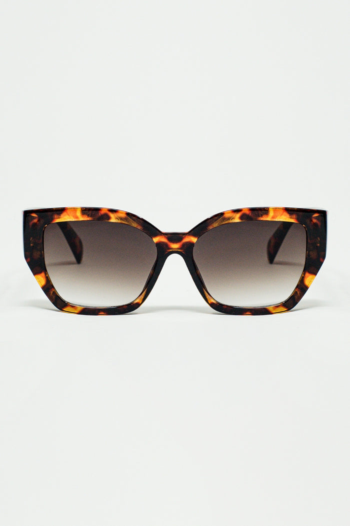 geometric polarized sunglasses with gradient dark lenses and tortoise shell