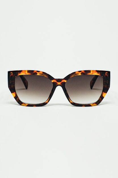 geometric polarized sunglasses with gradient dark lenses and tortoise shell