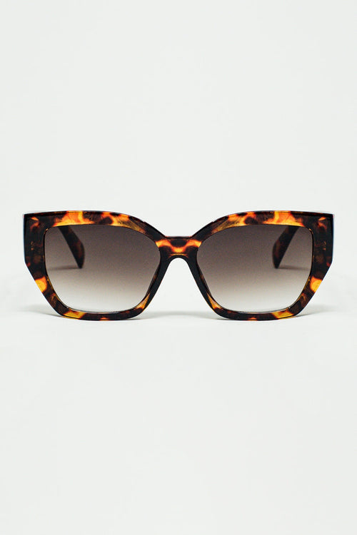 geometric polarized sunglasses with gradient dark lenses and tortoise shell