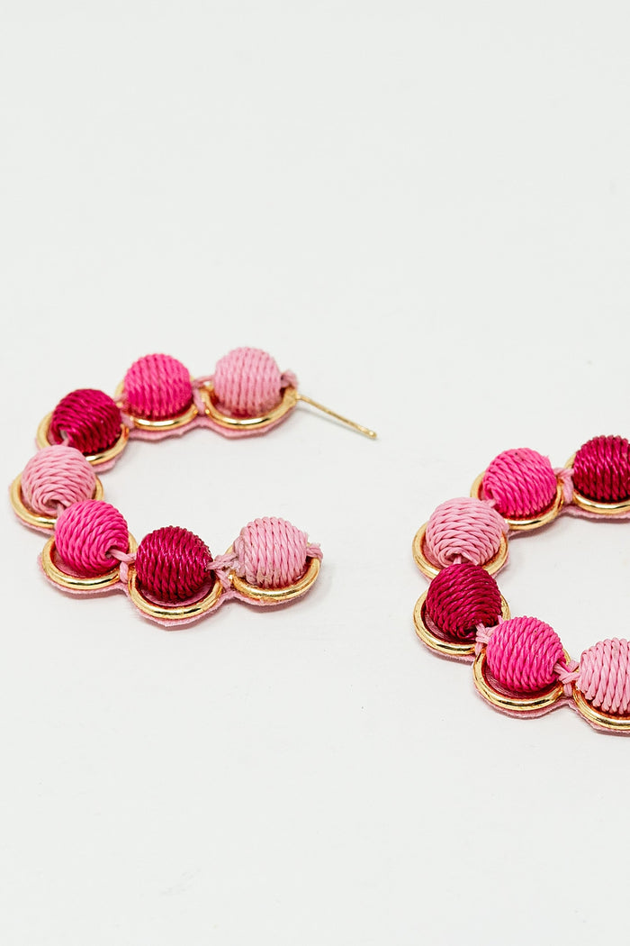 Gold Hoop Earring With Woolen Spheres in Pink and Fuchsia