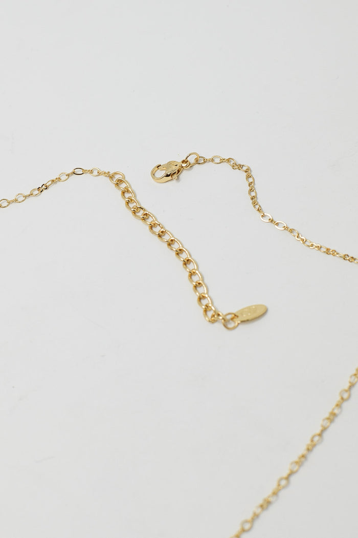 Golden Necklace with Star Charm and Green Bead