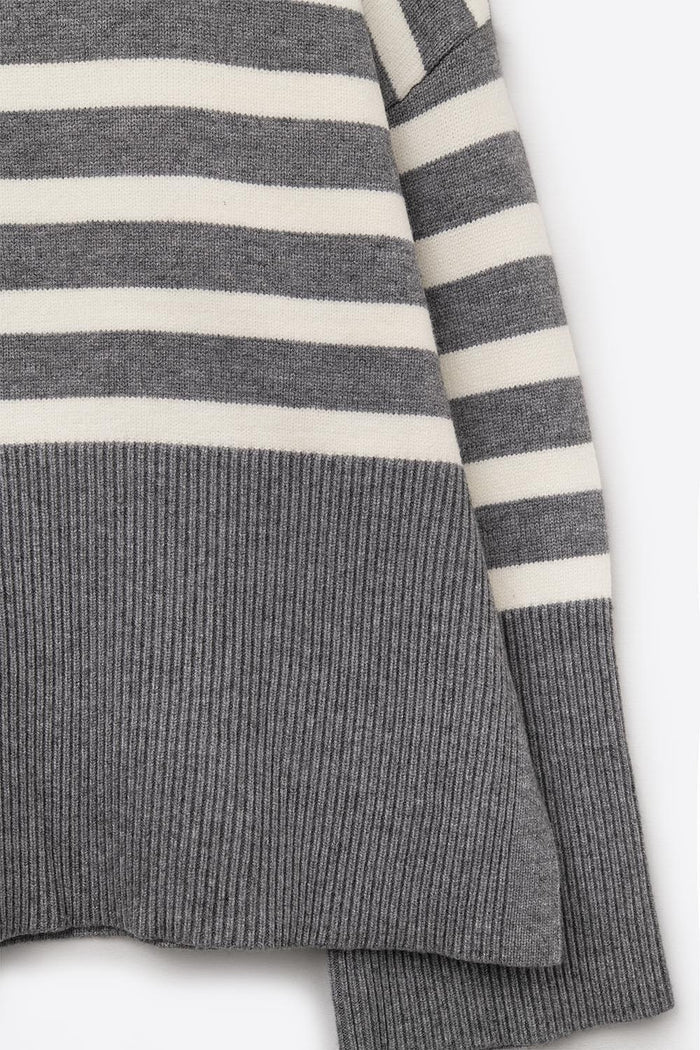 Gray oversized turtleneck sweater with white stripes and splits on the side
