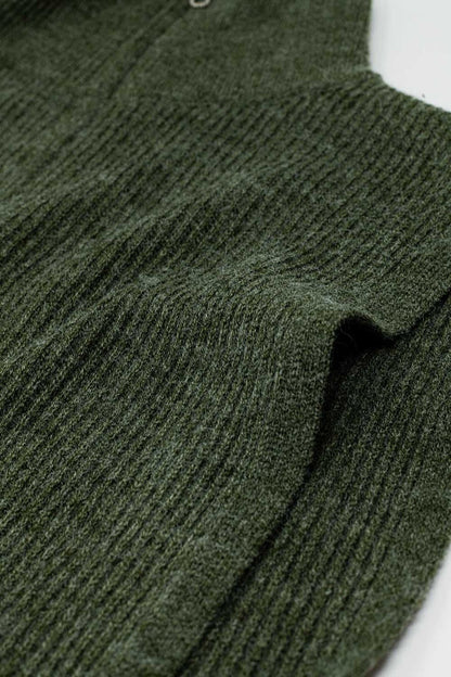 Green sleeveless turtleneck sweater with zipper closure