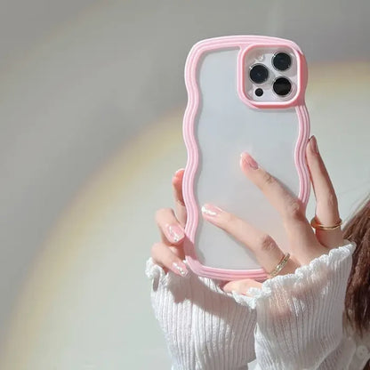 a woman holding a pink phone case