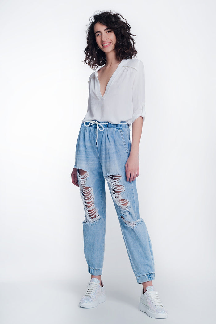 Heavily ripped boyfriend jeans in light denim - Denim