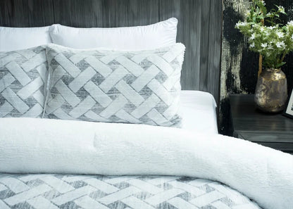 Quilted winter bedding set with light chevron pattern on pillows and duvet