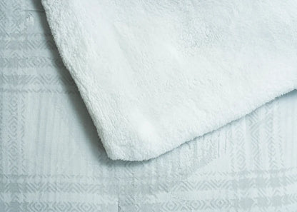 Light grey plush duvet top with carved geometric pattern and soft textured finish