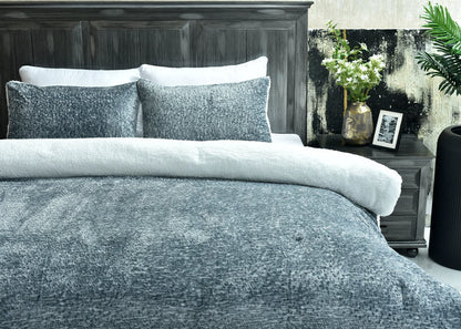 Light grey flannel 3-piece bedding set on bed with two square pillow covers