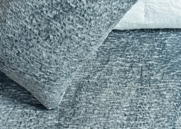 Light grey flannel duvet with textured fabric close-up