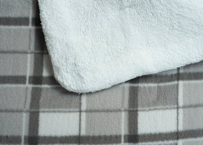 Plush grey comforter fabric close-up with soft sherpa-like texture