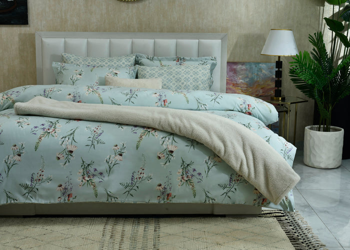 Ice blue comforter set with floral print, matching shams and pillows