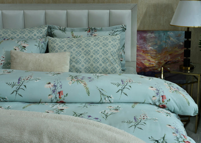 Ice blue comforter and pillows with botanical floral pattern