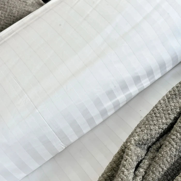 White duvet cover with light blue pinstripe pattern, close-up