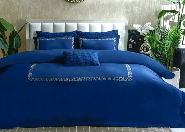 7-piece cobalt blue duvet cover set with coordinated shams and decorative borders