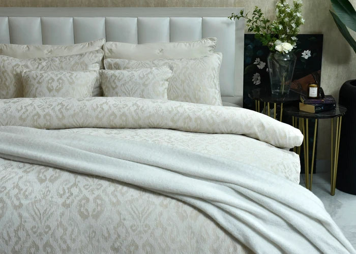 Beige duvet cover set with woven jacquard pattern and coordinated pillow shams