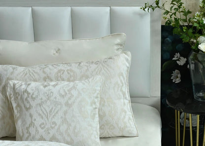 Beige jacquard duvet cover with matching pillows in a textured woven pattern