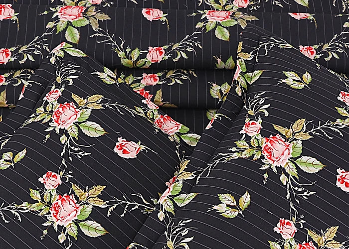 Black cotton bed sheet with scattered rose blooms and thin vertical pin stripes