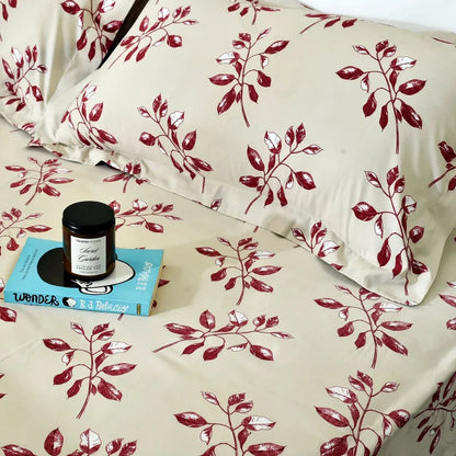 Microfiber bed sheet close-up, white fabric with red cherry branch print